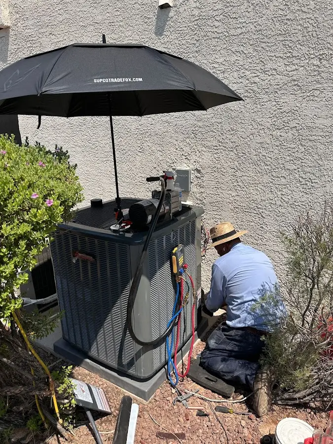 HVAC technician performing outdoor AC maintenance in Bay Harbor Islands